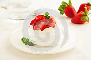 Meringue nests with strawberry cream