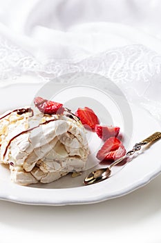 Meringue roulade with cream,strawberries and raspberries