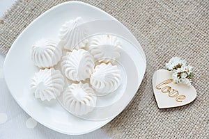 Meringue - the Traditional French dessert on a light background close up