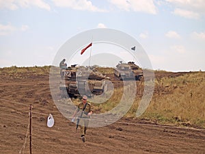 Merkava tanks and Israeli soldiers in training armored forces