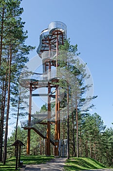 Merkine observation tower in forest at sunny day in summer