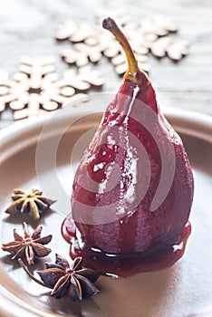 Merlot-poached pear on the plate