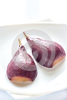 Merlot-poached pear on the plate