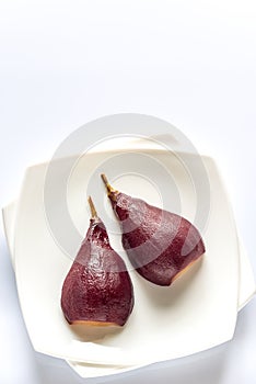 Merlot-poached pear on the plate