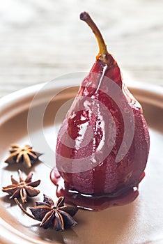 Merlot-poached pear on the plate