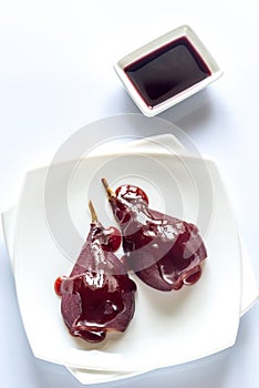 Merlot-poached pear on the plate