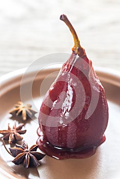 Merlot-poached pear on the plate