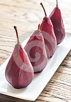 Merlot-poached pears on the plate