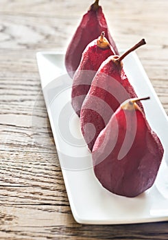 Merlot-poached pears on the plate