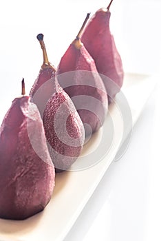 Merlot-poached pears on the plate