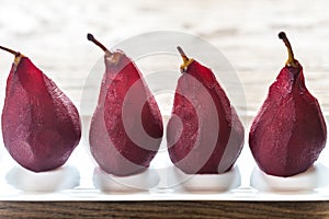 Merlot-poached pears on the plate