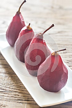 Merlot-poached pears on the plate