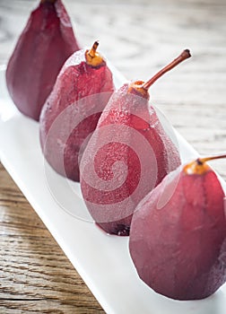 Merlot-poached pears on the plate