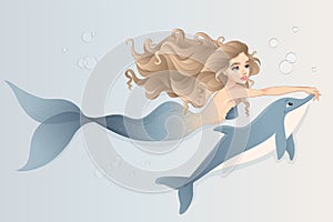 Mermaid with dolphin swimming in the sea