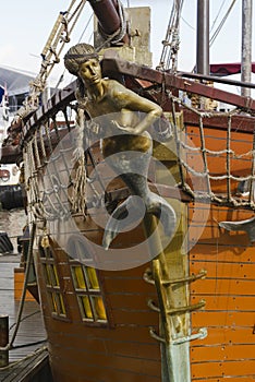 Mermaid figurehead on old sail ship photo