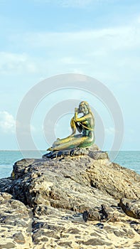 Mermaid statues on the beach