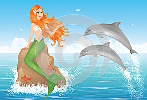 Mermaid and two dolphins.