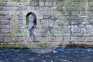 Mermaid of Uzupis. Sculpture on the embankment of the Vilnia river, Vilnius, Lithuania