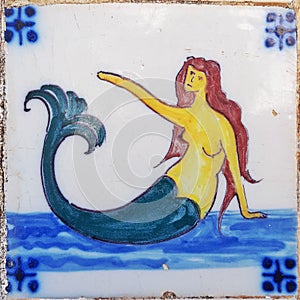 Mermaid waving Portuguese antique tile