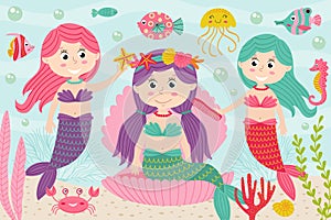 Mermaids comb and decorate their hair underwater photo