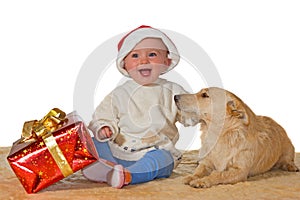 Merry baby enjoying Christmas with dog