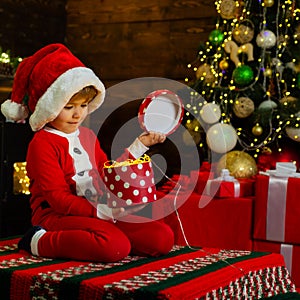 Merry and bright christmas. Lovely baby enjoy christmas. Childhood memories. Santa boy little child celebrate christmas