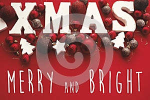 Merry and Bright Christmas text on Xmas wooden word with red ba