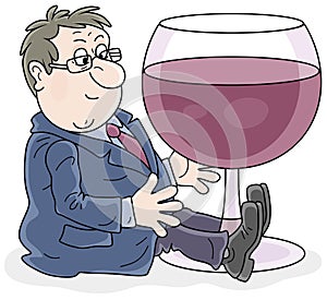 Merry businessman with a glass of wine