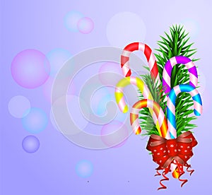 Merry Chirstmas, composition with candies,fir tree branches, red bow on blue background with bokeh.