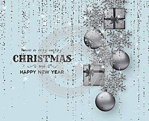 Merry Christmas background with shiny snowflakes, silver balls, gift boxes and grey colored tinsel and streamer photo