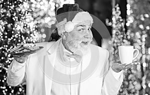 Merry christmas. Bearded senior man Santa Claus. Santa Claus relaxing. Winter vacation. Elderly grandpa at home