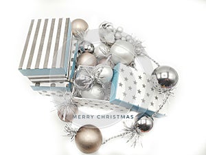 Merry Christmas card with silvered and golden balls in white background