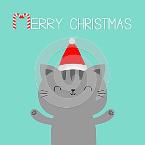 Merry Christmas. Cat holding hands up. Paw print. Red Santa Claus hat. Cartoon kawaii character. Cute face icon. Kitten kitty.