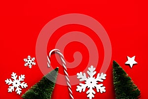 Merry Christmas. Christmas trees,snowflakes and striped candy cane with copy space. Christmas concept background