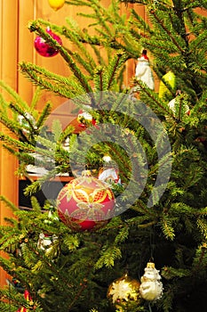 Merry Christmas Colorful Balls on the evergreen tree as a Holidays Background. Vintage Christmas Decoration