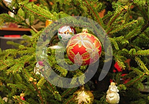 Merry Christmas Colorful Balls on the evergreen tree as a Holidays Background. Vintage Christmas Decoration - Christmas Balls