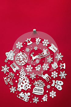 Merry christmas concept, xsmas ball made of white wooden toys on red, vertical