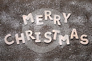 Merry Christmas With Cookie Letters on Wooden Background