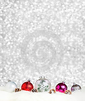 Merry Christmas decoration ball on white fur at silver bokeh light background,Banner vertical Holiday greeting card