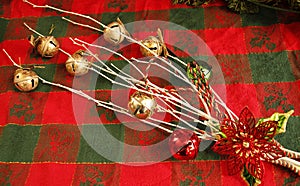 CHRISTMAS decorations, white branches, jingle bells, metal red poinsettia flower,