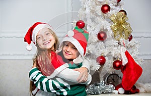 Merry christmas. Family holiday tradition. Children cheerful celebrate christmas. Kids christmas costumes santa and elf