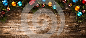 Merry Christmas Frame with real wood green pine and colorful baubles,