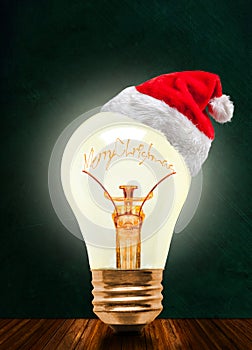 Merry Christmas Glowing Light Bulb With Santa Hat And Copy Space