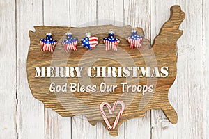 Merry Christmas God bless our troops greeting with stars on weathered wood USA map