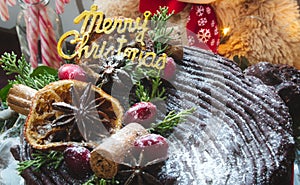 Merry Christmas gold lettering on a chocolate gateau cake