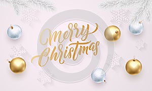 Merry Christmas golden calligraphy lettering, Xmas gold and silver balls on snowflakes pattern. Vector Xmas holiday greeting card photo