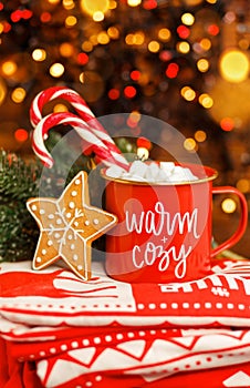 Merry Christmas greeting card. Hot chocolate infront Xmas tree.