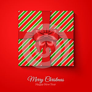 Merry Christmas Greeting Card with Striped Gift Box.