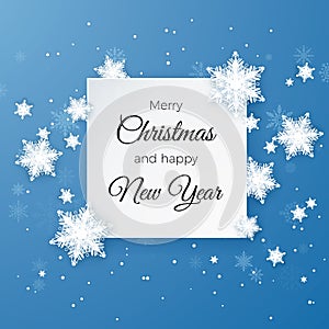 Merry Christmas Greetings card on blue background. Paper cut snow flake. Happy New Year. Winter snowflakes background. Snowfall