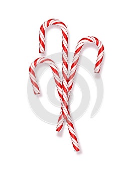 Merry Christmas greetings in a realistic 3D Candy Cane in the background. Vector illustration